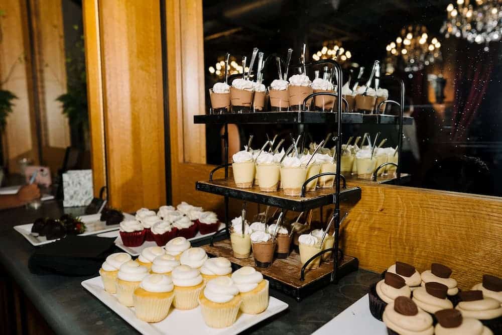 A dessert table with cupcakes